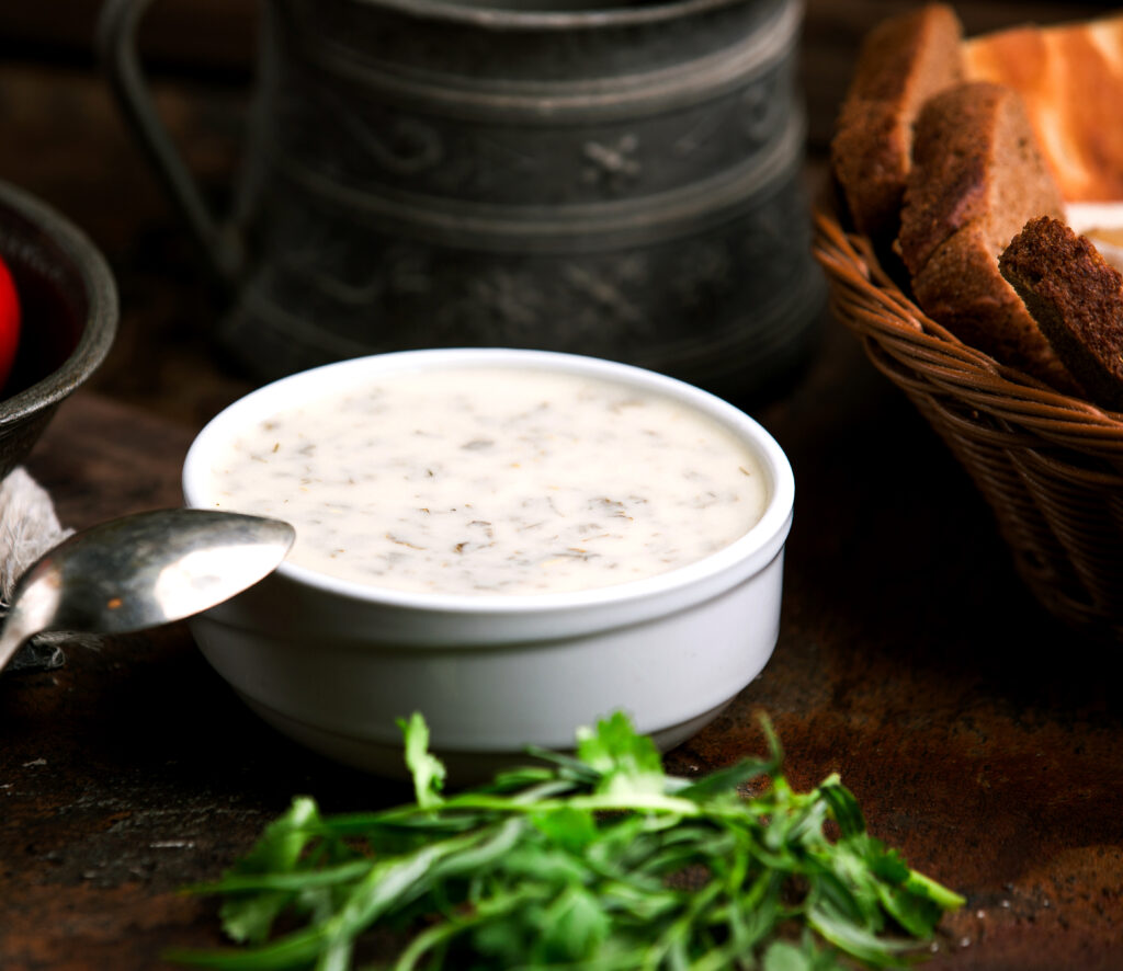 Perfectly made Alfredo Sauce recipe ready to pour over fettuccine.
