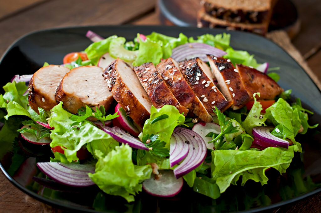 Fresh vegetable salad with grilled  chicken breast.