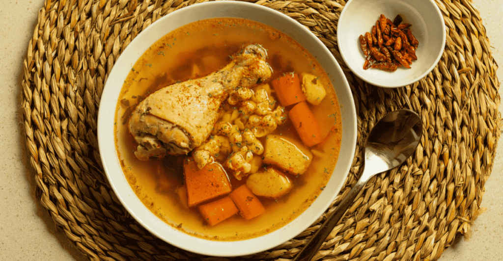 A bowl of hearty chicken stew filled with tender chicken, vegetables, and a rich broth.
