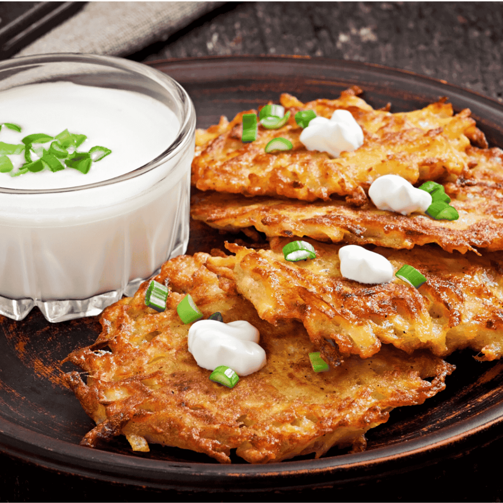 Fried potato pancakes on the old wooden background