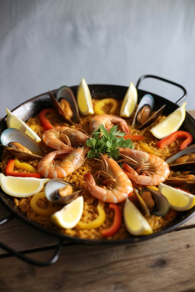 Family style Spanish paella fresh from the stove with traditional ingredients