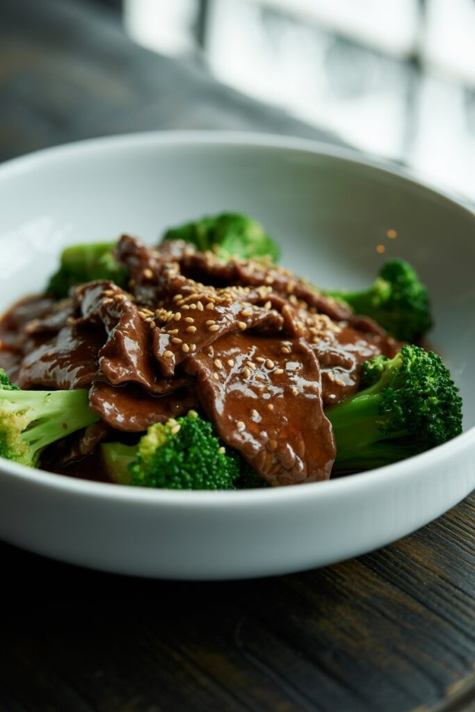 Savory beef and broccoli stir fried in a wok with aromatic seasonings