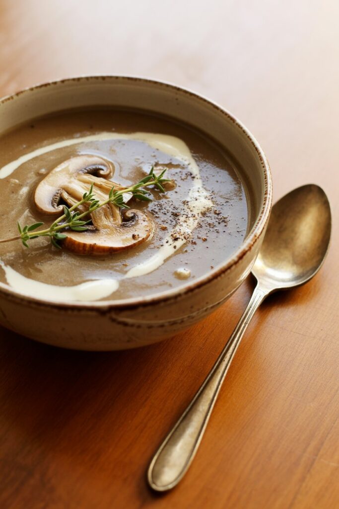 Rich and velvety mushroom soup topped with parsley and black pepper.