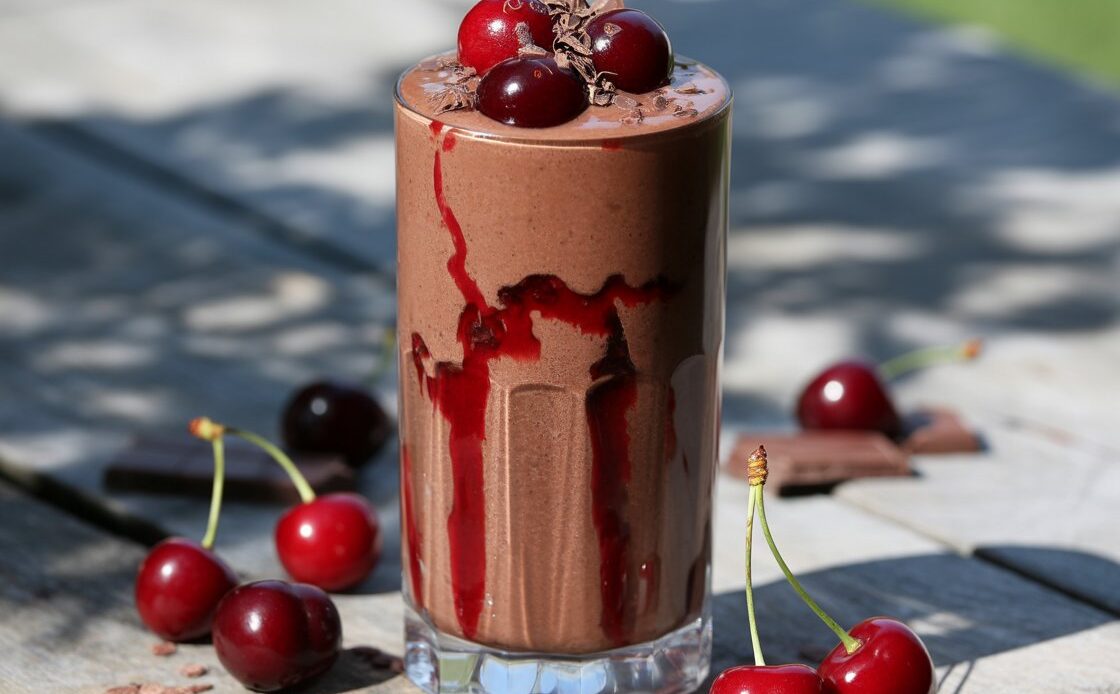 Ingredients for chocolate cherry smoothie laid out on a kitchen counter.